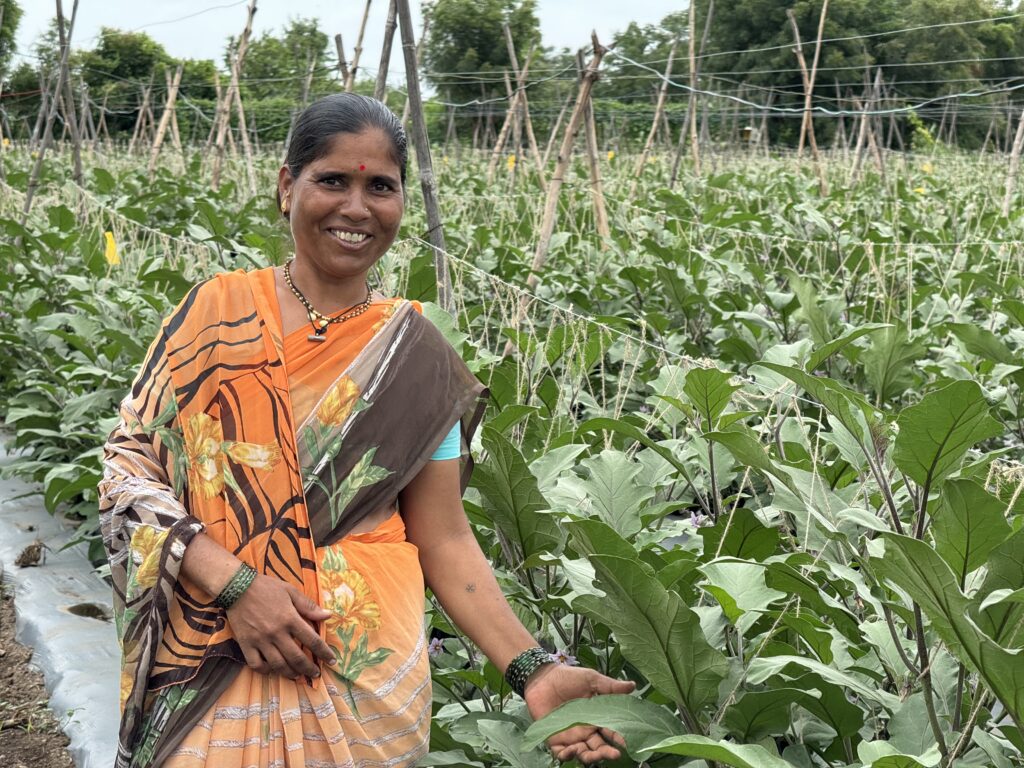 Woman in a field smiling